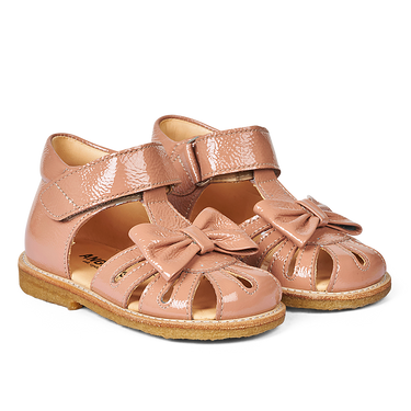 Starter sandal with a bow and velcro closure