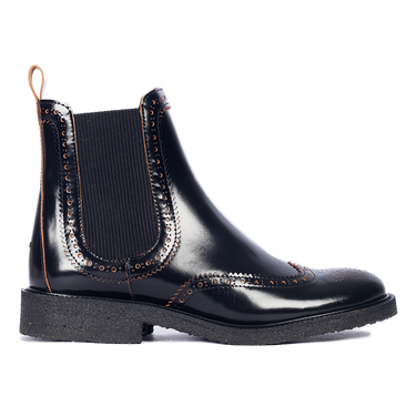 Boot with decorative brogue pattern